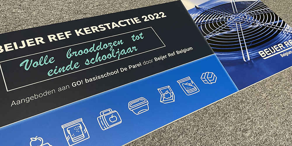 Cheque voor Basisschool De Parel, met vermelding dat Beijer Ref Belgium deelneemt aan het initiatief ‘Lege Brooddozen